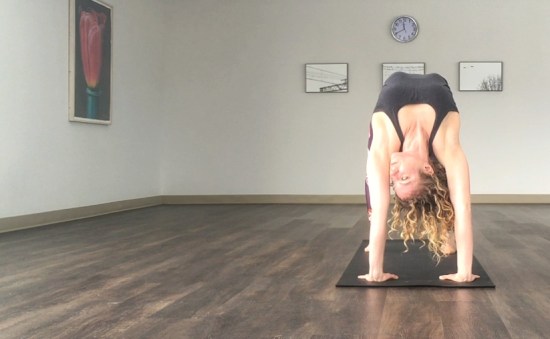 Somerjill in wheel pose (urdhva danurasana), facing forward.